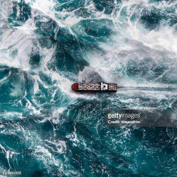 container ship on the sea - tormenta tiempo atmosférico fotografías e imágenes de stock