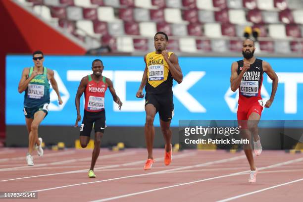 Alphas Leken Kishoyian of Kenya, Akeem Bloomfield of Jamaica and Machel Cedenio of Trinidad and Tobago compete in the Men's 400 Metres heats during...