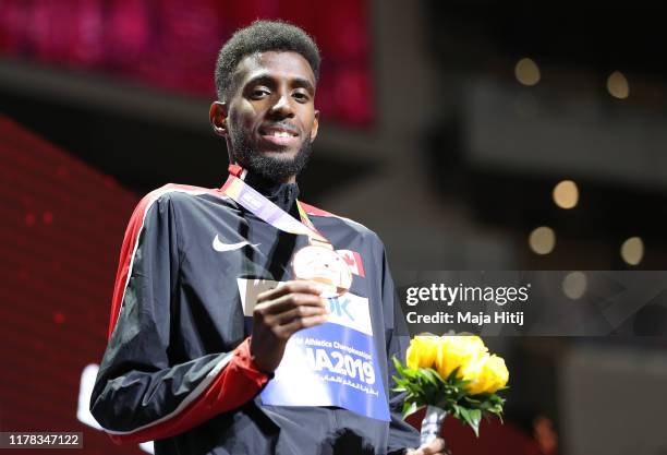 Mohammed Ahmed of Canada poses with the bronze medal for the Men's 5000 Metres during day five of 17th IAAF World Athletics Championships Doha 2019...