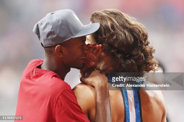 Mutaz Essa Barshim of Qatar talks Gianmarco Tamberi of Italy after the Men's High Jump qualification during day five of 17th IAAF World Athletics...