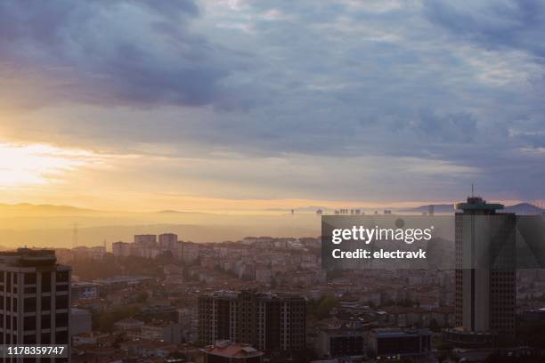 misty sunrise over the city - dramatic weather over istanbul stock pictures, royalty-free photos & images