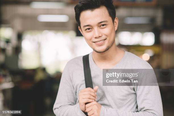 an asian muslim malay man portrait at wet market in the morning smiling - handsome muslim men stock pictures, royalty-free photos & images