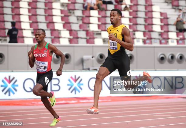 Alphas Leken Kishoyian of Kenya and Akeem Bloomfield of Jamaica compete in the Men's 400 Metres heats during day five of 17th IAAF World Athletics...