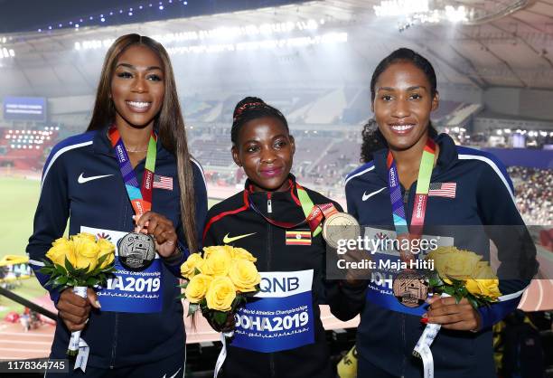 Halimah Nakaayi of Uganda, gold, Raevyn Rogers of the United States, silver, and Ajee Wilson of the United States, bronze, pose during the medal...