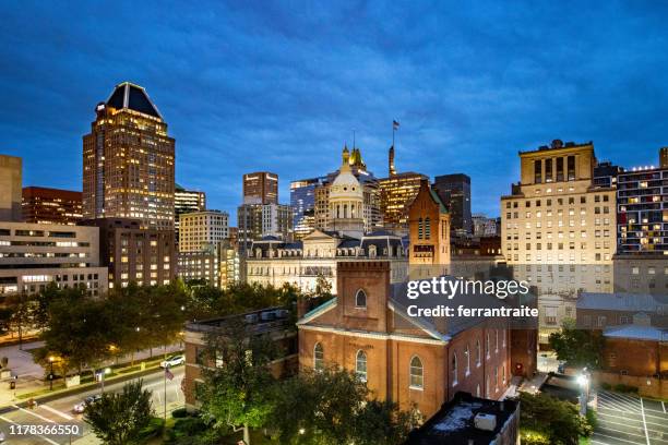 baltimore skyline at dusk - baltimore maryland stock pictures, royalty-free photos & images