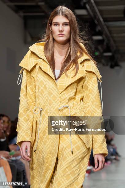 Model walks the runway during the Kristina Fidelskaya Womenswear Spring/Summer 2020 show as part of Paris Fashion Week on September 30, 2019 in...