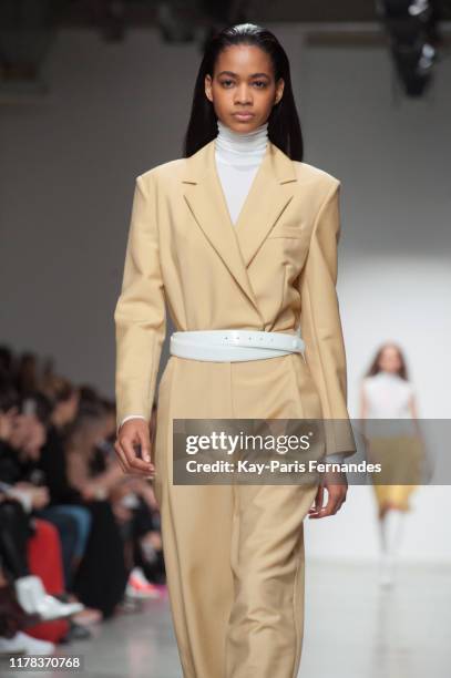 Model walks the runway during the Kristina Fidelskaya Womenswear Spring/Summer 2020 show as part of Paris Fashion Week on September 30, 2019 in...