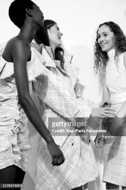 Models pose backstage ahead of the Kristina Fidelskaya Womenswear Spring/Summer 2020 show as part of Paris Fashion Week on September 30, 2019 in...