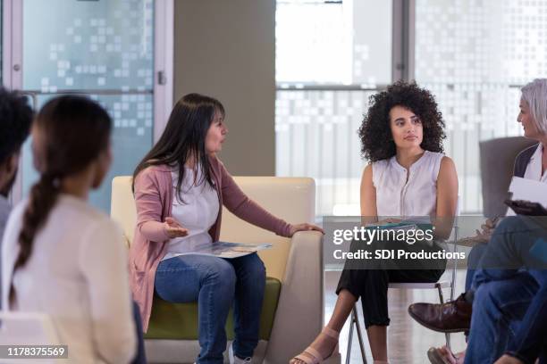 serious woman discussing important neighborhood issues - neighbours arguing stock pictures, royalty-free photos & images