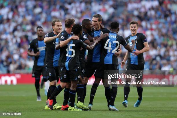 Emmanuel Bonaventure Dennis of Club Brugge celebrates with teammates after scoring his team's first goal during the UEFA Champions League group A...