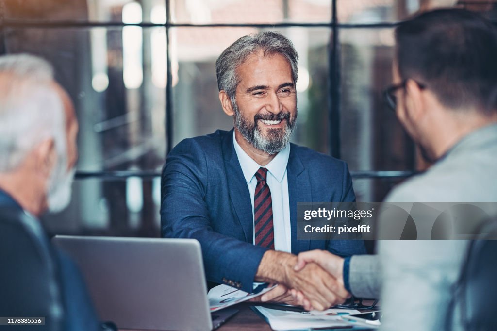 Businessmen handshake in the office