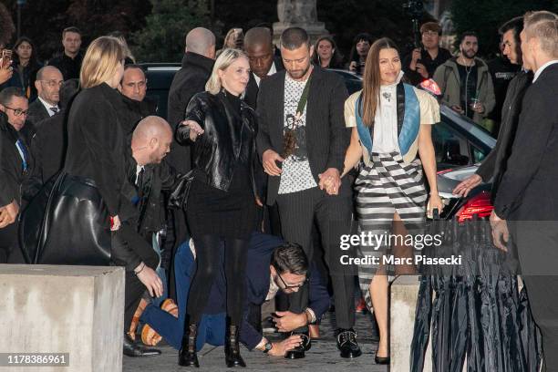 Vitalii Sediuk jumps on singer Justin Timberlake as he arrives to attend the Louis Vuitton Womenswear Spring/Summer 2020 show as part of Paris...