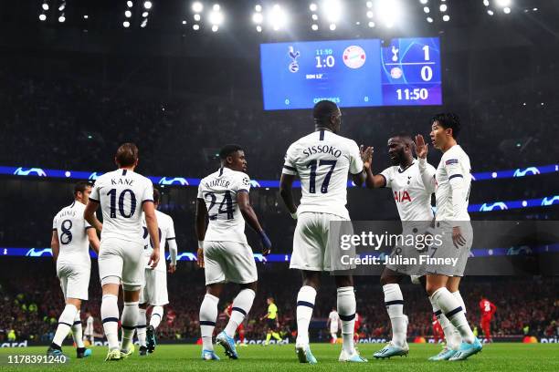 Heung-Min Son of Tottenham Hotspur celebrates with teammates Moussa Sissoko and Tanguy Ndombele after scoring his team's first goal during the UEFA...