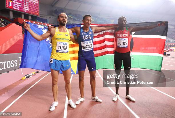 Donavan Brazier of the United States, gold, Amel Tuka of Bosnia and Herzegovina, silver, and Ferguson Cheruiyot Rotich of Kenya, bronze, celebrate...