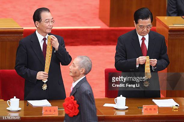 Chinese President Hu Jintao and Chinese Premier Wen Jiabao award medals for the outstanding Communists during the celebration of the Communist...