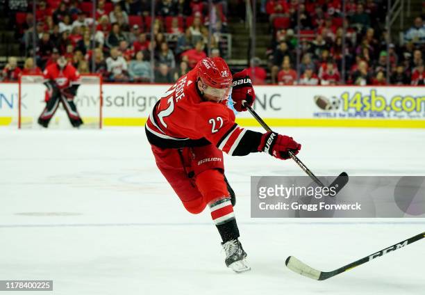 Brett Pesce of the Carolina Hurricanes fires a shot on goal during an NHL game against the Chicago Blackhawks on October 26, 2019 at PNC Arena in...