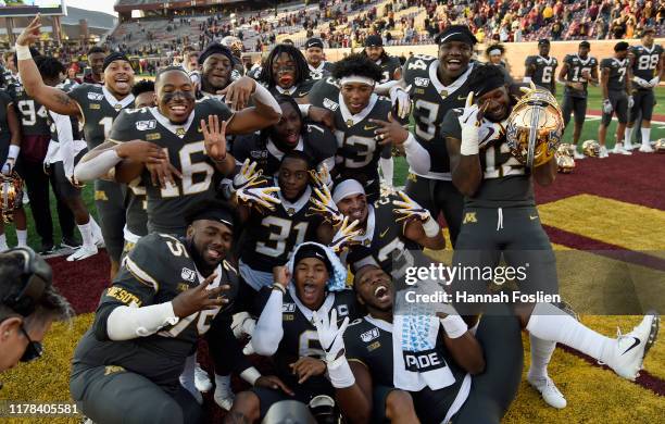The Minnesota Gophers pose for a photo after defeating the Maryland Terrapins in the game at TCF Bank Stadium on October 26, 2019 in Minneapolis,...