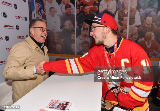 Calgary Flames alumni Mike Vernon signs autographs in The PreGame in advance of the 2019 Tim Hortons NHL Heritage Classic as the Calgary Flames take...