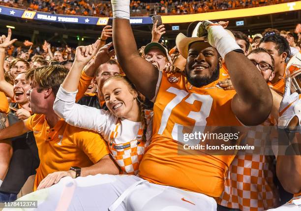 Tennessee Volunteers offensive lineman Trey Smith celebrates with fans after defeating the South Carolina Gamecocks 41-21 on October 26 at Neyland...