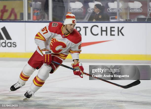 Michael Frolik of the Calgary Flames skates during warmup before taking on the Winnipeg Jets during the 2019 Tim Hortons NHL Heritage Classic at...
