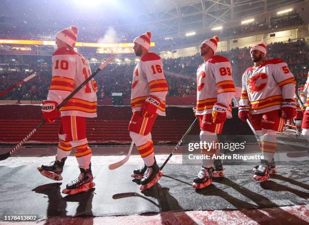 Derek Ryan and Tobias Rieder of the Calgary Flames walk to the ice before taking on the Winnipeg Jets during the 2019 Tim Hortons NHL Heritage...