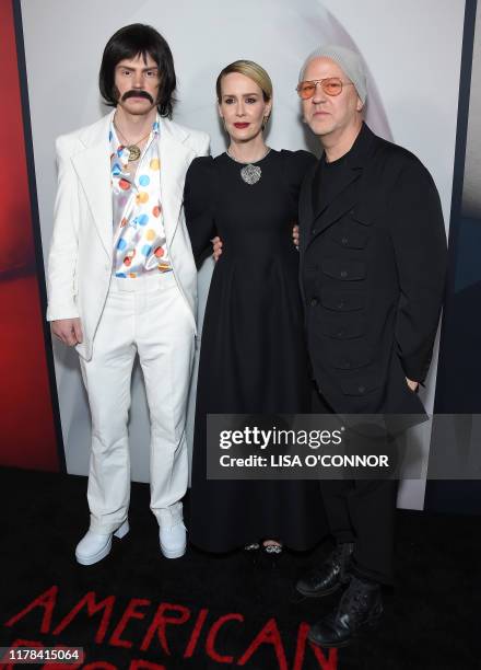 Actor Evan Peters, Sarah Paulson and and Ryan Murphy arrive for the Red Carpet event celebrating 100 episodes of FX's "American Horror Story" at the...