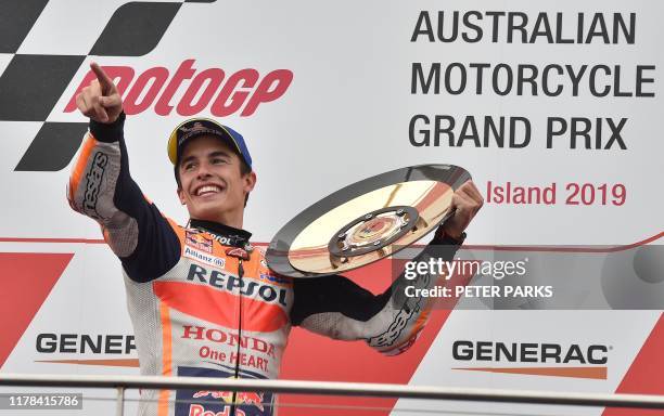 Repsol Honda MotoGP rider Marc Marquez of Spain holds up the trophy after winning the Australian motorcycle Grand Prix at Phillip Island on October...