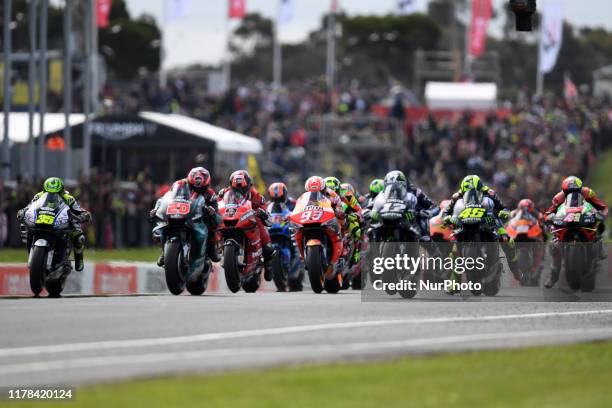 Riders battle for position as the Australian MotoGP race begins at the Phillip Island Grand Prix Circuit on October 27, 2019 in Phillip Island,...