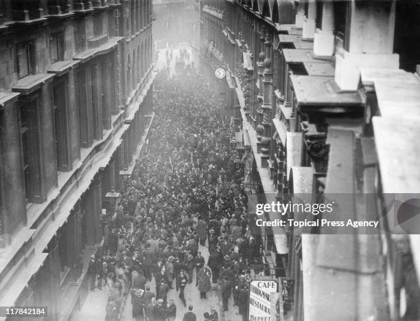 Aerial view looking down on the crowds gathered on Throgmorton Street, outside the London Stock Exchange, on the announcement that the Gold Standard...