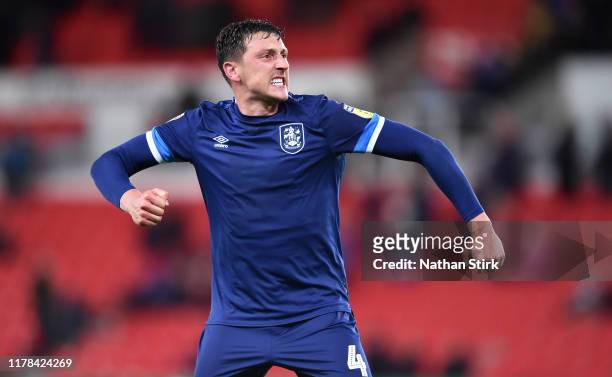 Tommy Elphick of Huddersfield reacts during the Sky Bet Championship match between Stoke City and Huddersfield Town at Bet365 Stadium on October 01,...