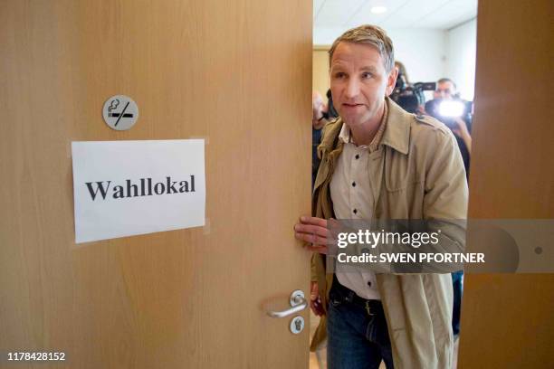 Bjoern Hoecke, top candiate for Thuringian state elections of the far-right AfD party, leaves after casting his ballot on October 27, 2019 at a...
