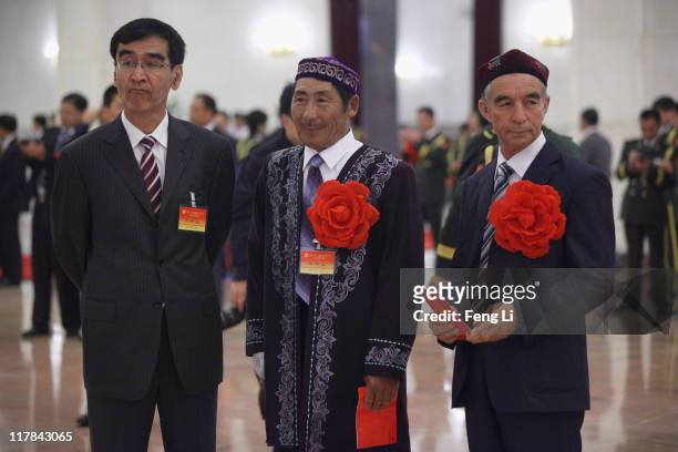 The outstanding ethnic minority members of the Communist Party of China attend the celebration of the Communist Party's 90th anniversary at the Great...