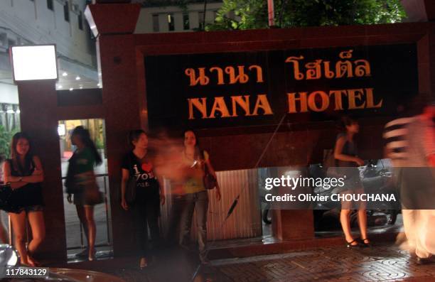 Thai prostitutes wait for customers in the street of Soi Nana on Sukhumvit road, a notorious hang out for foreigners looking for prostitutes, on June...