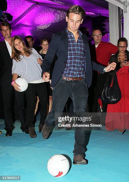 Jacob Burda kicks a ball during the Women's World Cup Night as part of the Digital Life Design women conference at Bavarian National Museum on June...