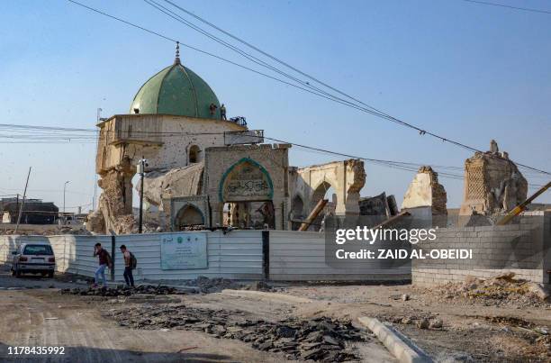 Picture taken on October 27, 2019 shows Mosul's Al-Nuri Mosque and the remains of the destroyed "Al-Hadba" leaning minaret next to it in the former...