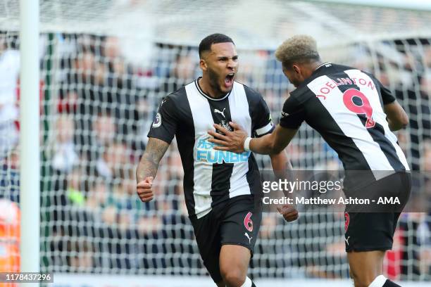 Jamaal Lascelles of Newcastle United celebrates after scoring a goal to make it 1-0 during the Premier League match between Newcastle United and...