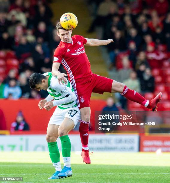 Aberdeen's Craig Bryson in action with Celtic's Mohamed Elyounoussi during the Ladbrokes Premiership match between Aberdeen and Celtic, at Pittodrie...