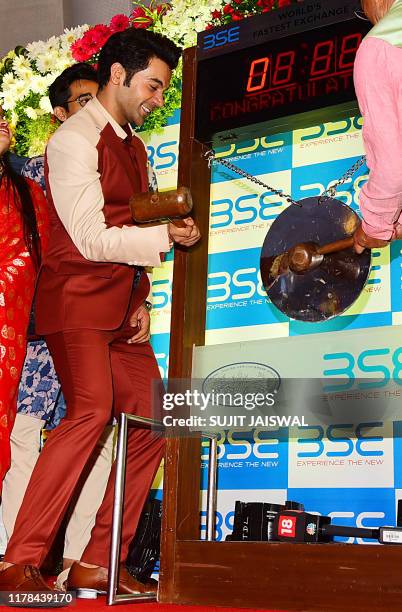 Bollywood actor Raj Kumar Rao rings the bell to start the Muhurat Trading, a special trading session on the occasion of Diwali, the Festival of...