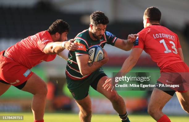 Leicester Tigers' EW Viljoen is tackled by Saracens' Titi Lamositele and Alex Lozowski during the Gallagher Premiership match at Welford Road,...