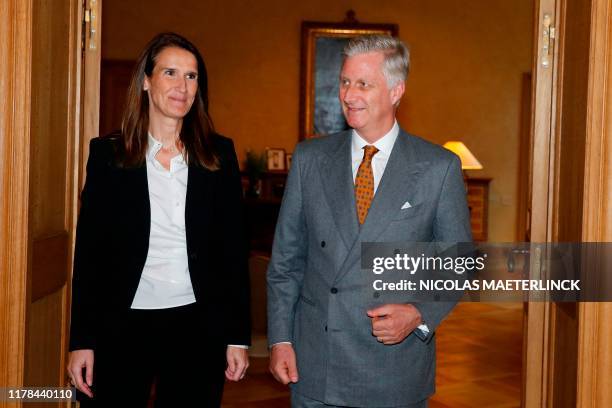 Belgian new Prime Minister Sophie Wilmes and King Philippe - Filip of Belgium pose after her appointment on October 27, 2019 in Brussels. - Belgian...