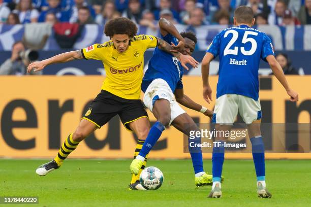Axel Witsel of Borussia Dortmund and Rabbi Matondo of FC Schalke 04 battle for the ball during the Bundesliga match between FC Schalke 04 and...