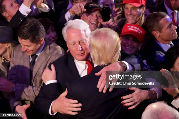Republican president-elect Donald Trump hugs his brother Robert Trump after delivering his acceptance speech at the New York Hilton Midtown in the...