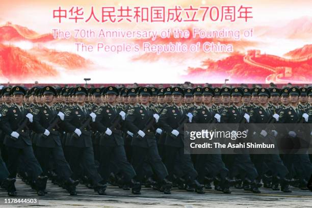 Chinese soldiers march on during the rehearsal of the military parade to celebrate the 70th Anniversary of the founding of the People's Republic of...