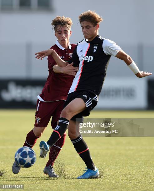 Giulio Doratiotto of Juventus U16 challenged by Ludovico Ruscello of Torino U16 during the match between Juventus U16 and Torino U16 at Juventus...