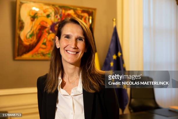 Belgian Prime Minister Sophie Wilmes poses for the photographer during the passing of the power to the new Prime Minister, in Brussels, Sunday 27...