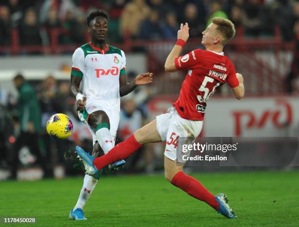 Eder of FC Lokomotiv Moscow and Nail Umyarov of FC Spartak Moscow vie for the ball during the Russian Football League match between FC Lokomotiv...