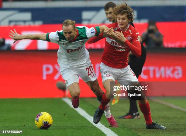 Vladislav Ignatyev of FC Lokomotiv Moscow and Alex Kral of FC Spartak Moscow vie for the ball during the Russian Football League match between FC...