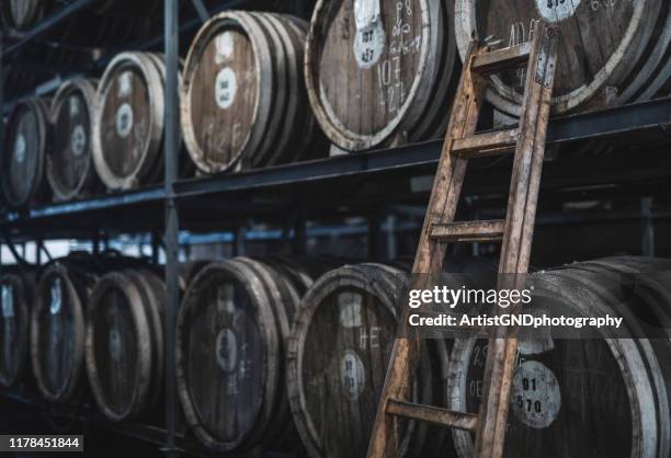 barrels in distillery - whiskey stock pictures, royalty-free photos & images