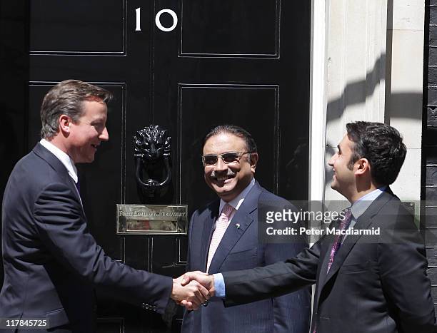 British Prime Minister David Cameron meets with Bilawal Bhutto as Pakistan's President Zardari looks on in Downing Street on July 1, 2011 in London,...