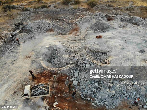 An aerial view taken on October 27, 2019 shows the site that was hit by helicopter gunfire which reportedly killed nine people near the northwestern...